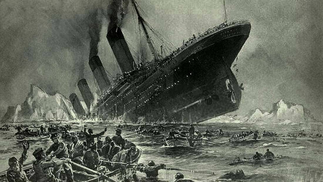 Photo of the sinking Titanic with surviving people in lifeboats.